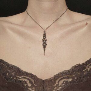 Gothic silver rosary necklace with a small silver chain